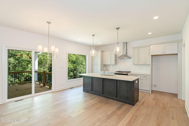 6714 Hypoint Ridge Rd, Crestwood, KY 40014 - kitchen with light countertops, decorative backsplash, a sink, visible vents, and wall chimney exhaust hood