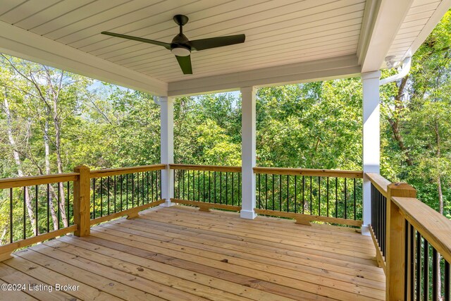 wooden terrace featuring ceiling fan