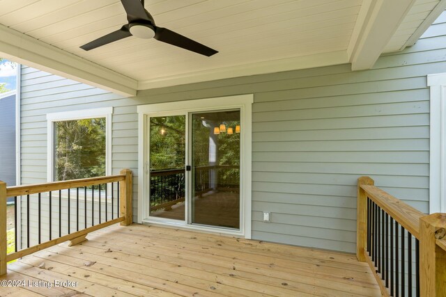 wooden terrace featuring ceiling fan