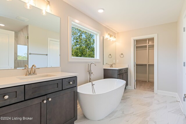 bathroom featuring vanity and separate shower and tub