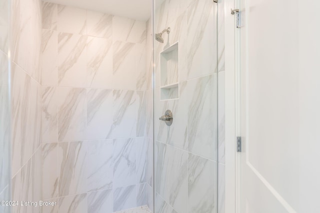 bathroom with tiled shower