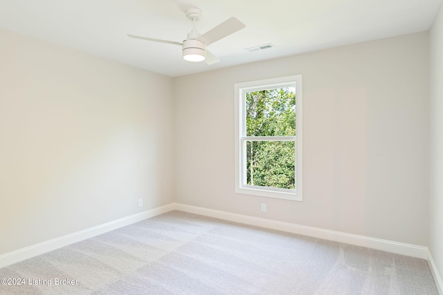 carpeted empty room with ceiling fan