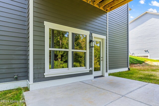 doorway to property with a patio