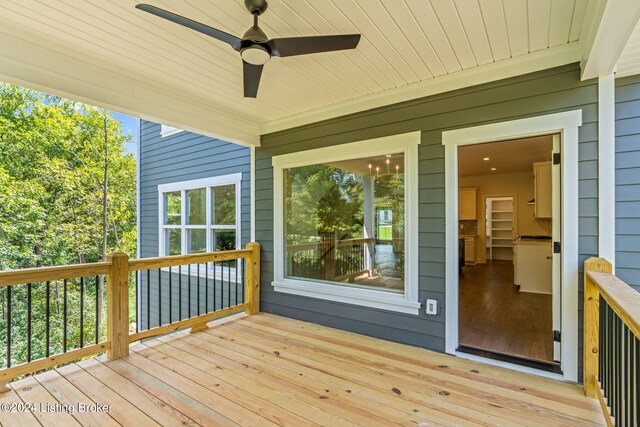 wooden deck featuring ceiling fan