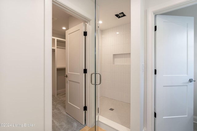 6715 Hypoint Ridge Rd, Crestwood, KY 40014 - bathroom featuring a spacious closet, a stall shower, and recessed lighting