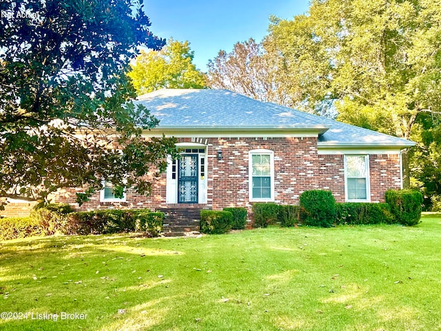 view of front of home with a front yard