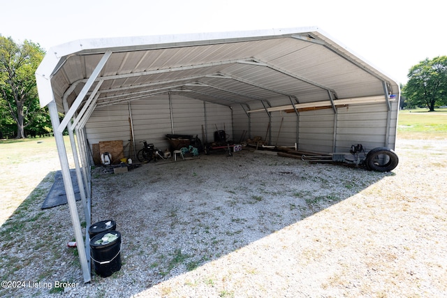 view of parking / parking lot featuring a carport