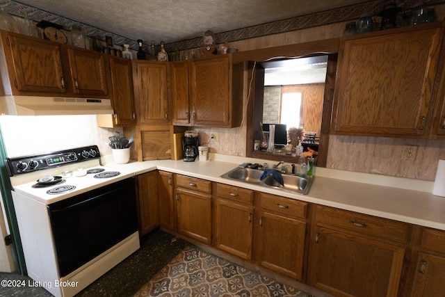 kitchen featuring white electric range, a textured ceiling, light tile patterned floors, and sink