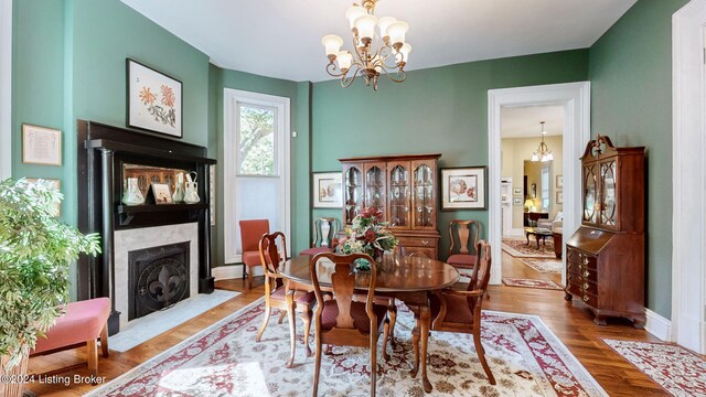 dining space with a notable chandelier and wood-type flooring