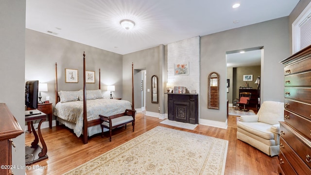 bedroom with light hardwood / wood-style floors