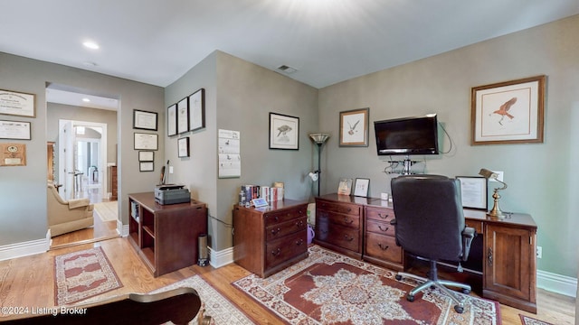 office space featuring light wood-type flooring