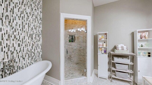 bathroom with plus walk in shower and tile patterned floors