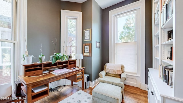 sitting room with light hardwood / wood-style flooring