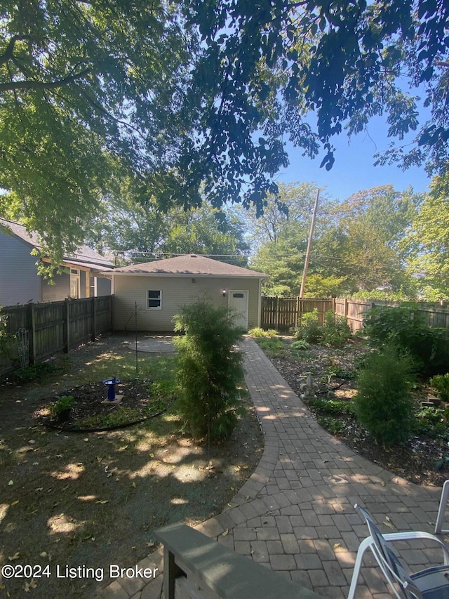 rear view of property featuring a patio area