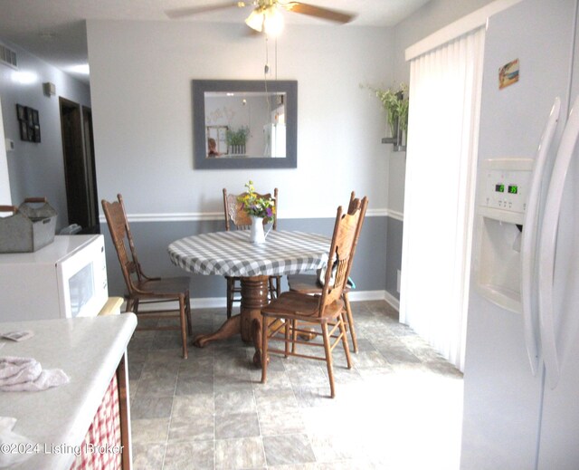 dining room featuring ceiling fan