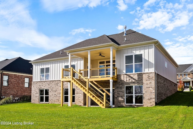 rear view of house featuring a yard and ceiling fan