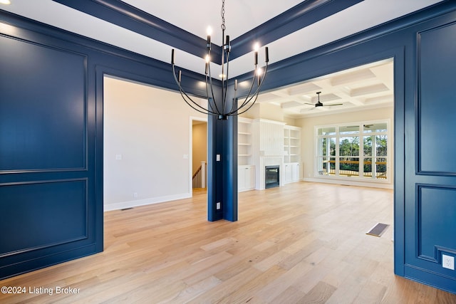 unfurnished living room featuring light hardwood / wood-style floors, coffered ceiling, beamed ceiling, and ceiling fan with notable chandelier