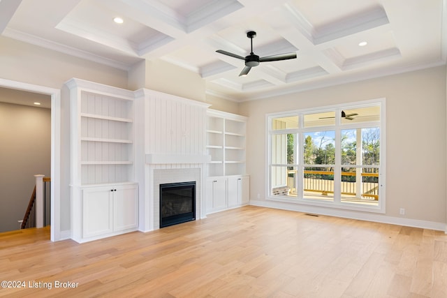 unfurnished living room with light wood-type flooring, ceiling fan, coffered ceiling, beam ceiling, and ornamental molding