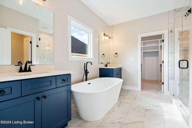 bathroom with vanity and separate shower and tub