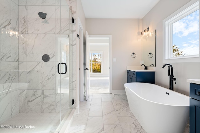 bathroom with vanity, independent shower and bath, and plenty of natural light