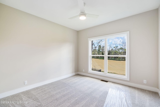 carpeted empty room with ceiling fan