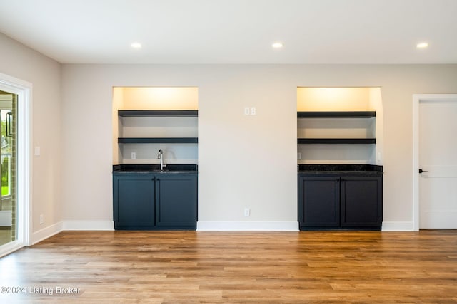 unfurnished living room with light wood-type flooring