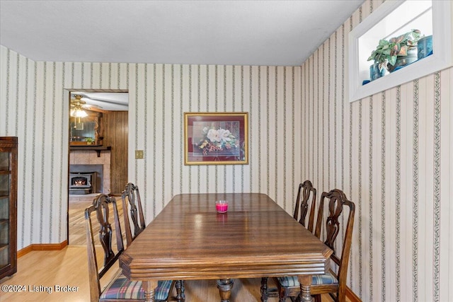 dining area featuring ceiling fan and light hardwood / wood-style floors