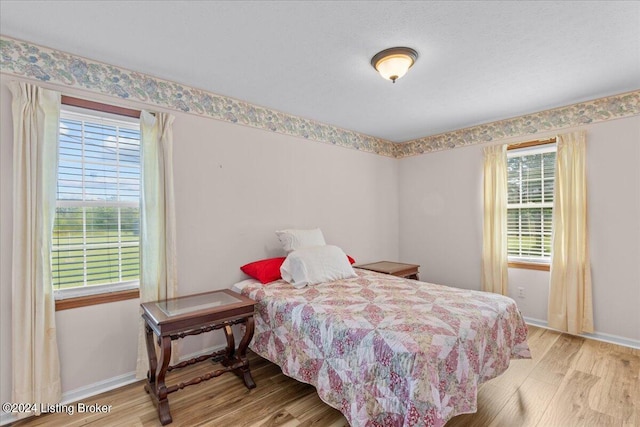 bedroom with light wood-type flooring