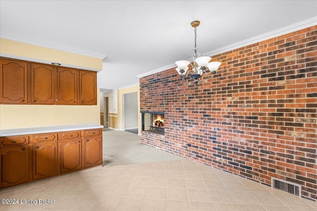 interior space featuring visible vents, an inviting chandelier, ornamental molding, and brick wall