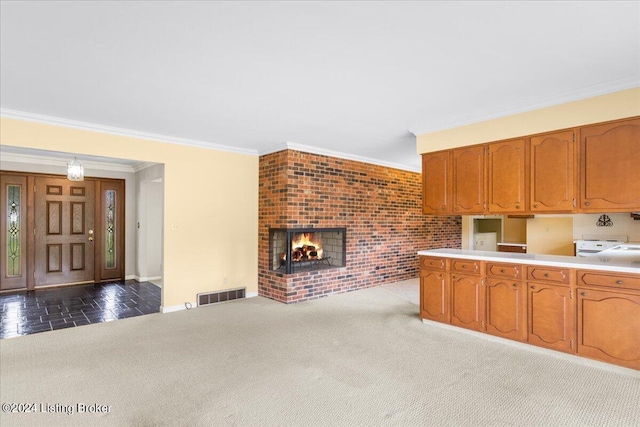 kitchen featuring carpet, visible vents, a fireplace, light countertops, and brown cabinets