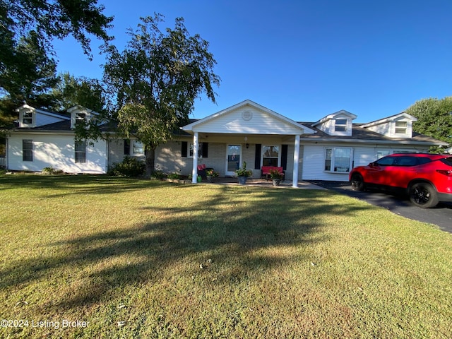 single story home featuring a porch and a front lawn