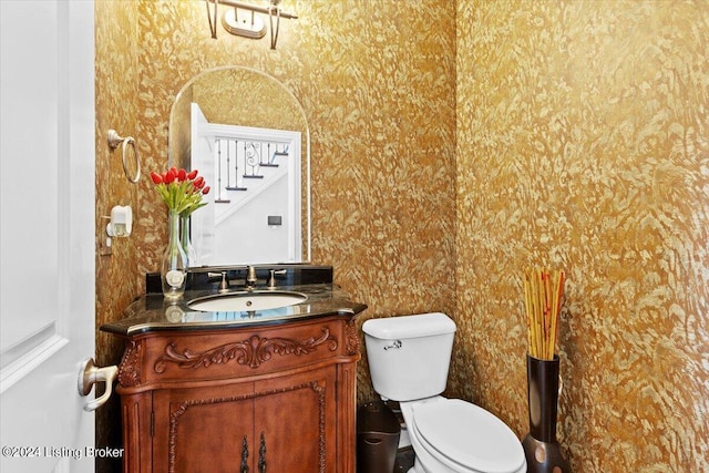 bathroom with vanity and toilet