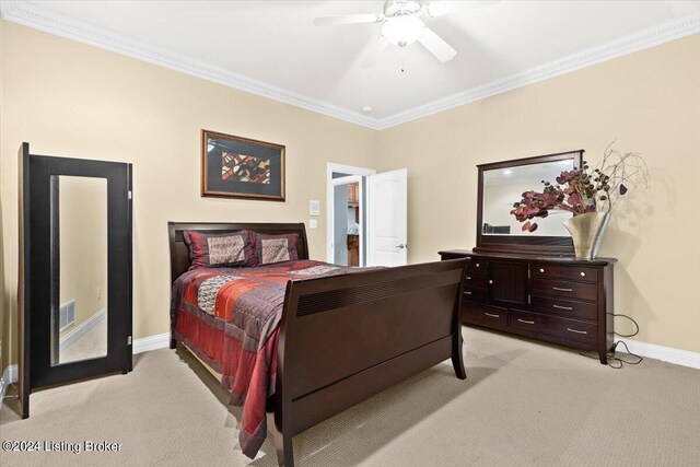 bedroom featuring ceiling fan, ornamental molding, and light carpet