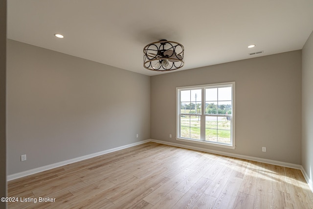 unfurnished room featuring light wood-type flooring