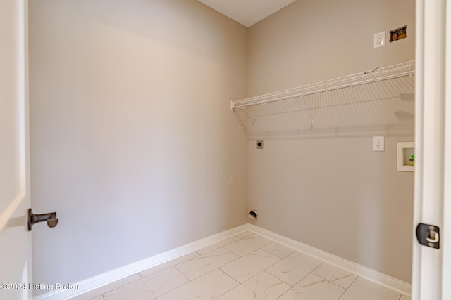 clothes washing area featuring hookup for a washing machine and electric dryer hookup