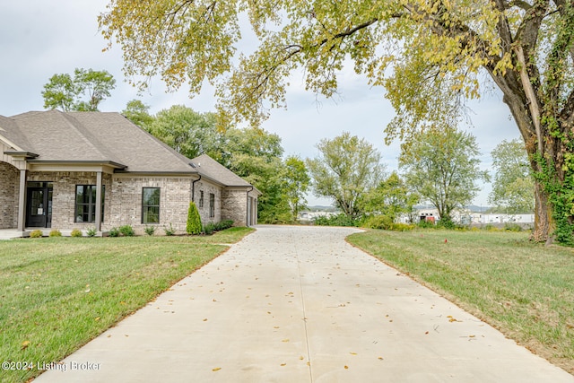 view of home's exterior with a lawn