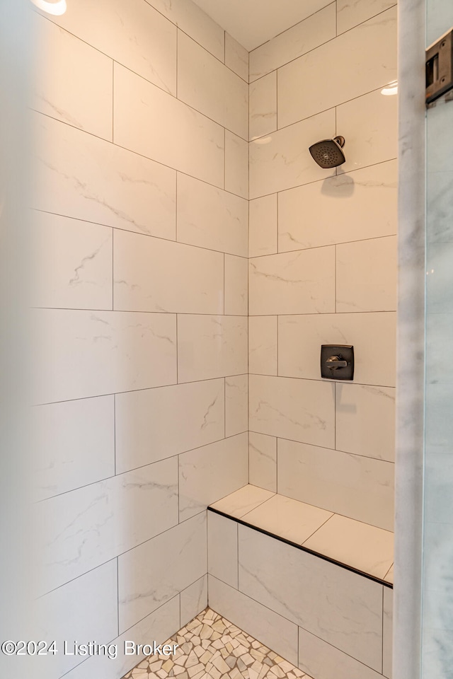 bathroom with tiled shower