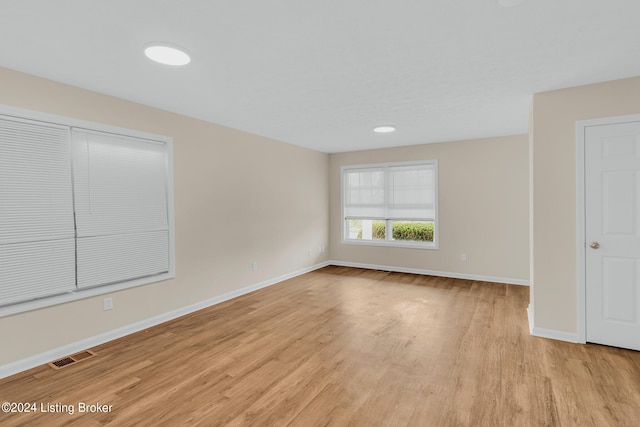 spare room featuring light hardwood / wood-style floors