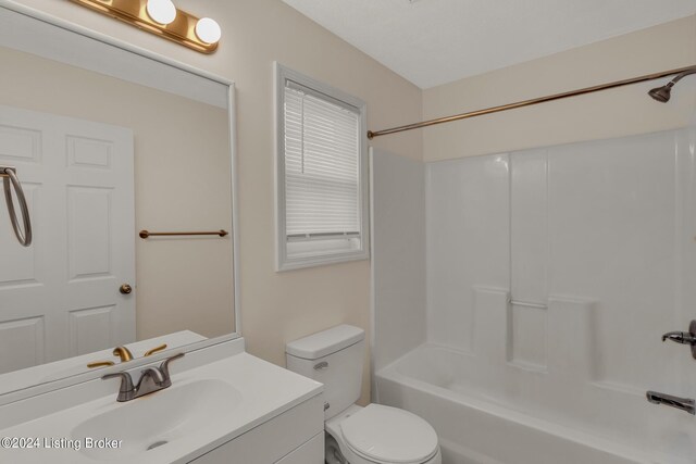 full bathroom featuring toilet, bathing tub / shower combination, and vanity