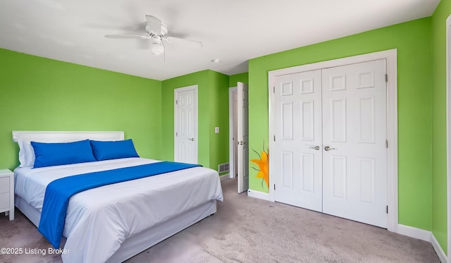 bedroom featuring light colored carpet and ceiling fan