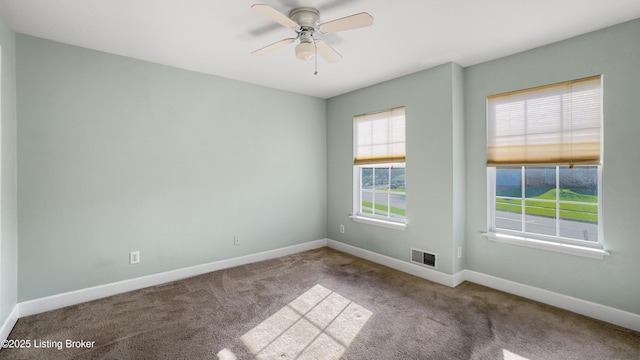 unfurnished room with carpet flooring and ceiling fan