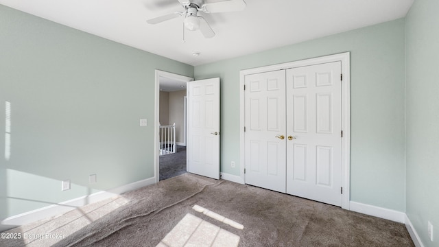 unfurnished bedroom with carpet flooring, a closet, and ceiling fan