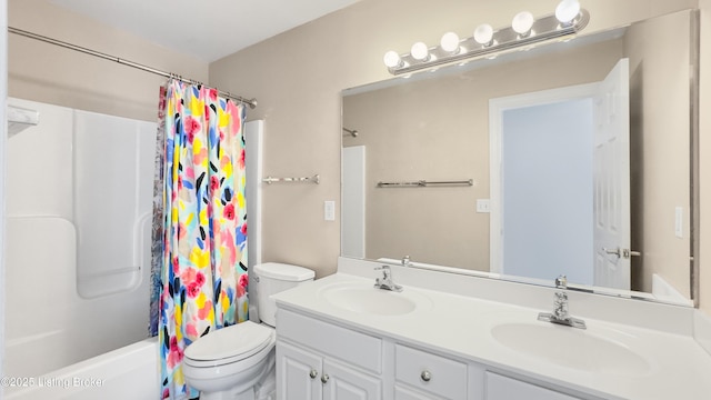 full bathroom with vanity, shower / bath combination with curtain, and toilet