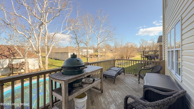 wooden deck featuring a pool