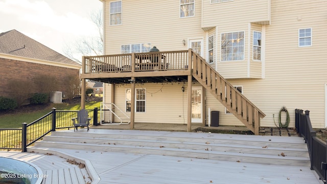 wooden deck with central air condition unit