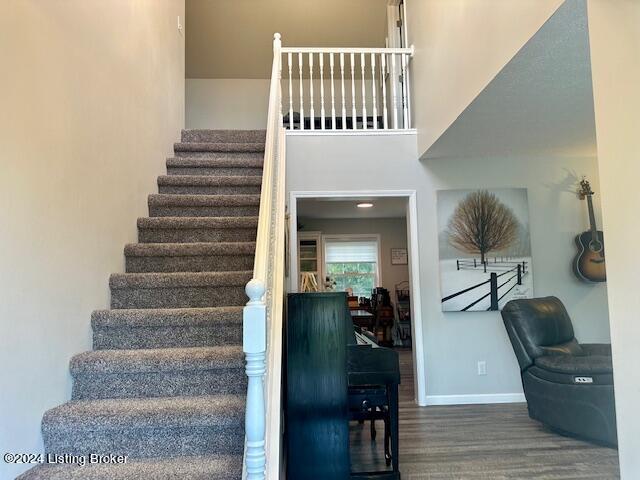 staircase featuring hardwood / wood-style floors