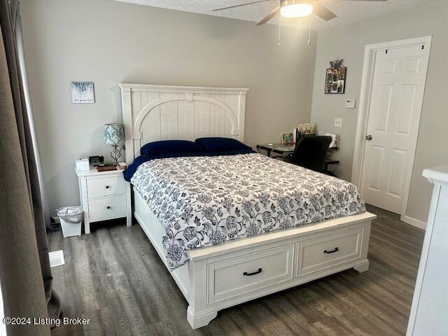 bedroom with dark wood-type flooring and ceiling fan