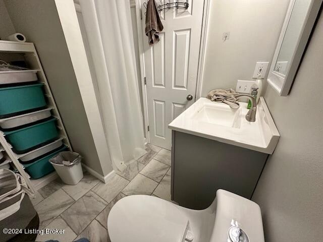 bathroom with vanity and toilet