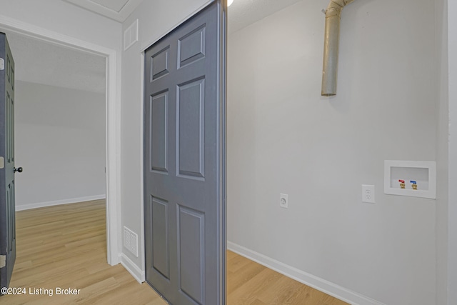 hall with hardwood / wood-style flooring