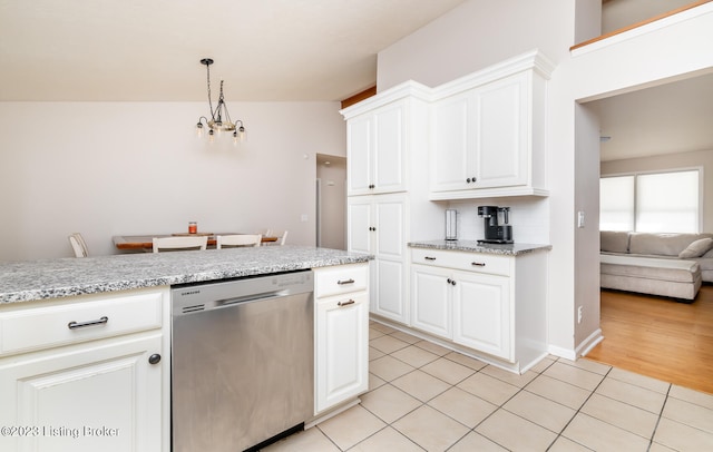 kitchen featuring dishwasher, vaulted ceiling, white cabinetry, and light wood-type flooring